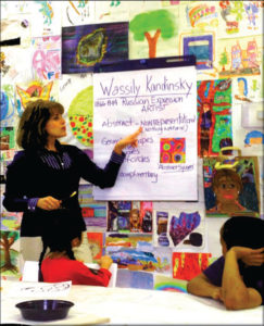 Young Picassos teacher Angelina Rodriguez leads an art class.